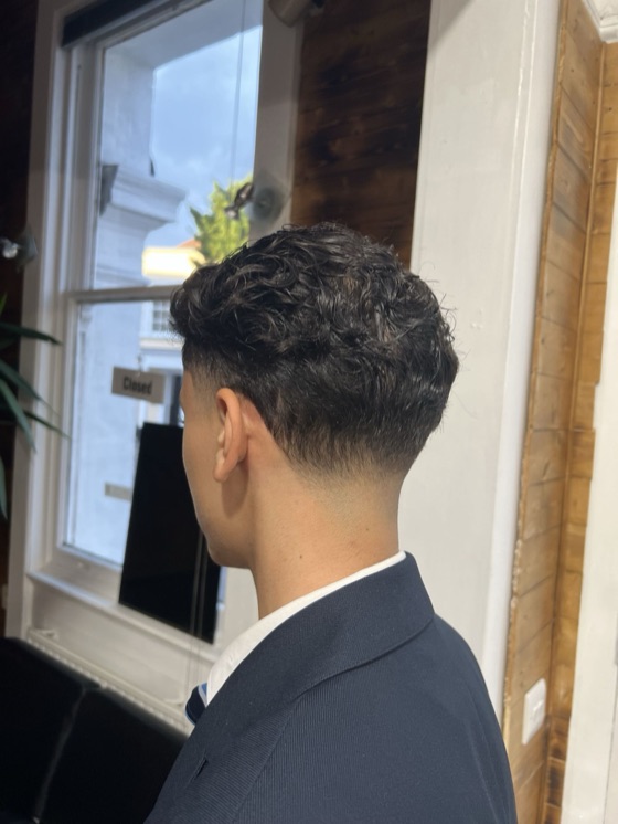 Textured curls with a low taper