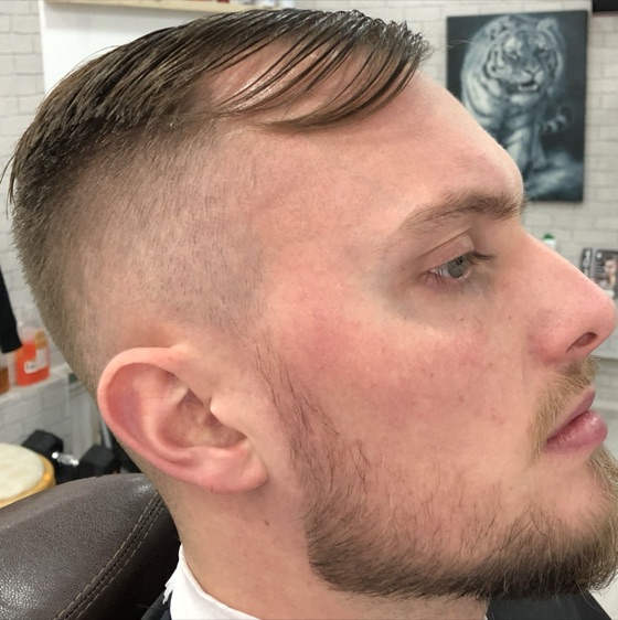 Slick side part, faded sides